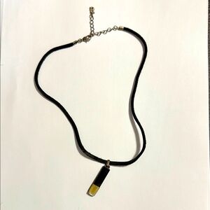 172.  Black and Gold Pendant Necklace with leather strap by Guess